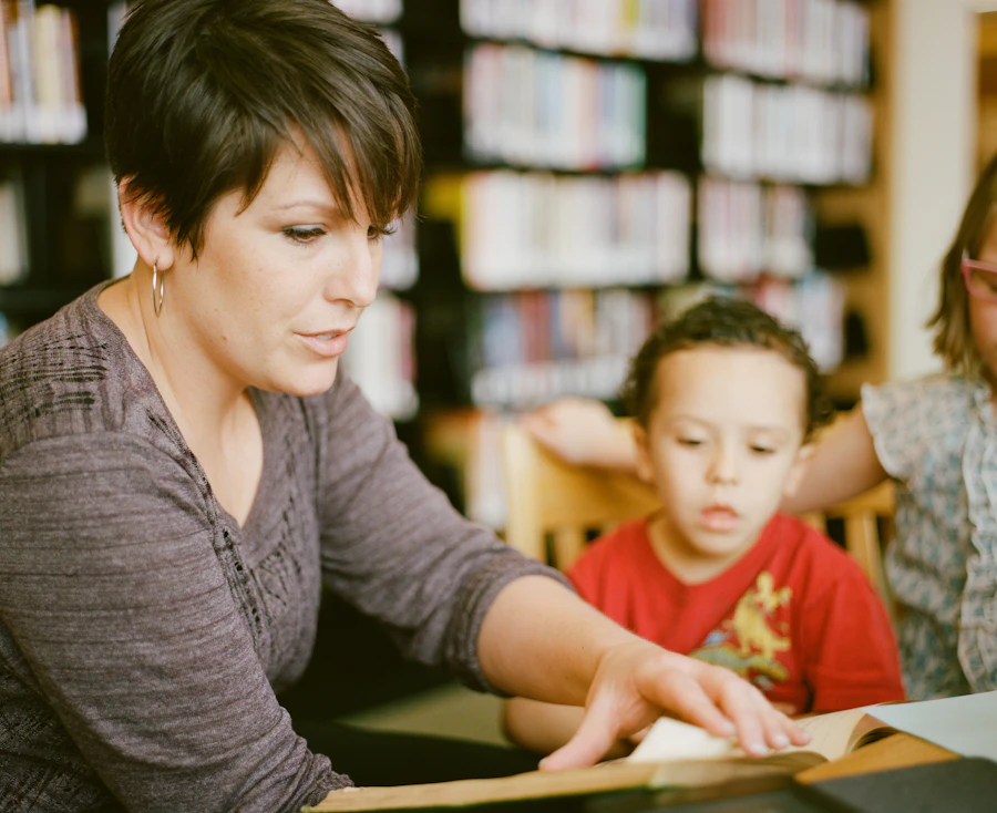 A teacher going over a student's writing with them